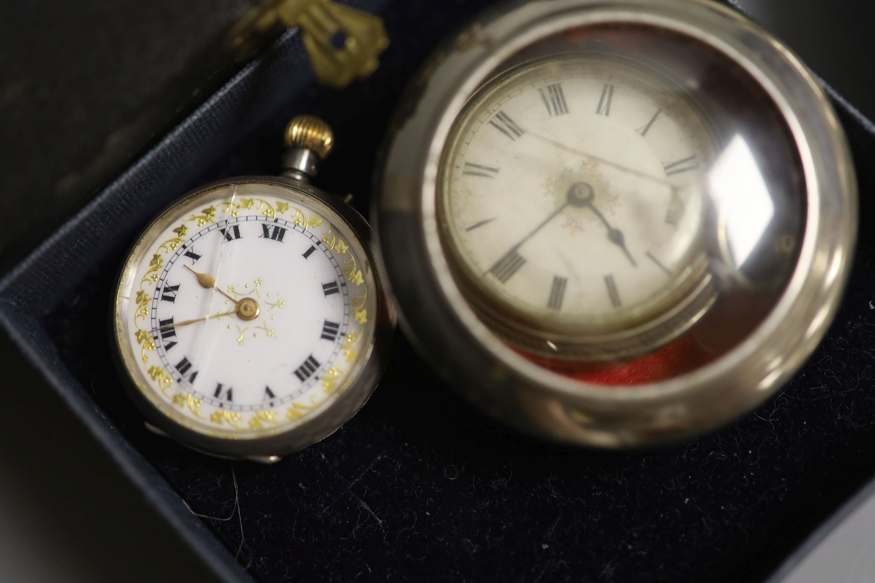 A plated silver stand, a fob watch, coins etc.